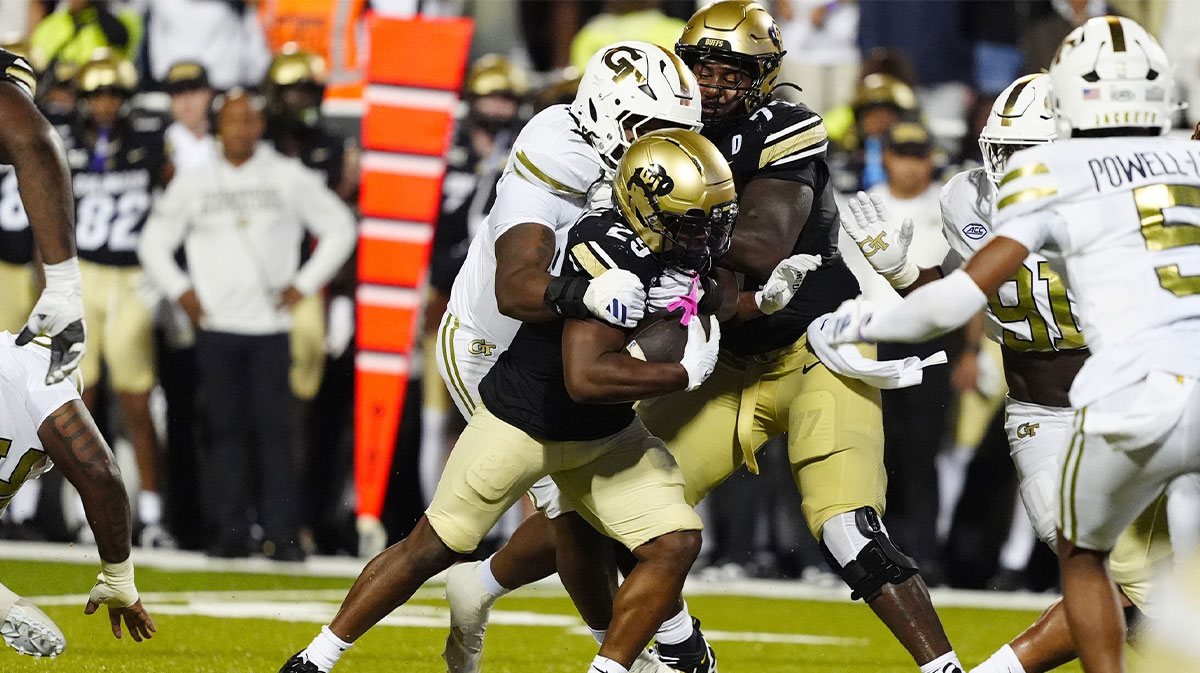Georgia Tech Yellow Jackets defensive lineman Akelo Stone (7) tackles Colorado Buffaloes running back Micah Welch (29) in the fourth quarter at Folsom Field.