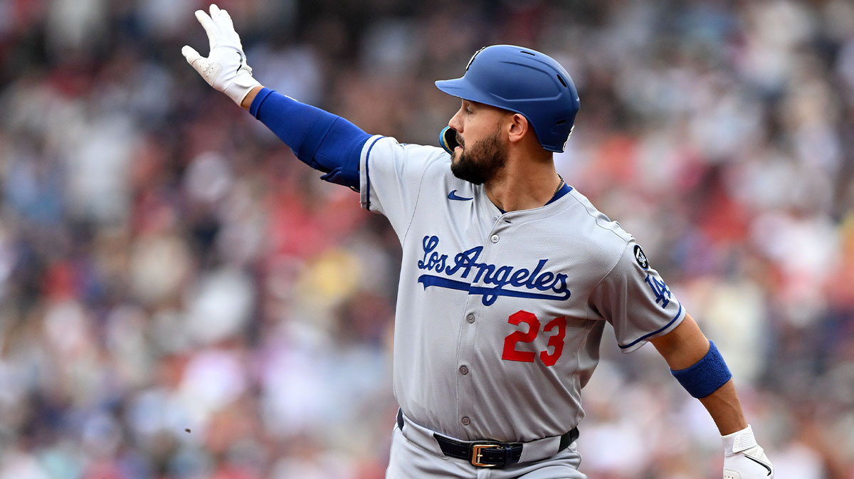 Los Angeles Dodgers outfielder Michael Conforto (23) scores a run on single by catcher Will Smith (16) in the game against the Cincinnati Reds in the seventh inning at Great American Ball Park.