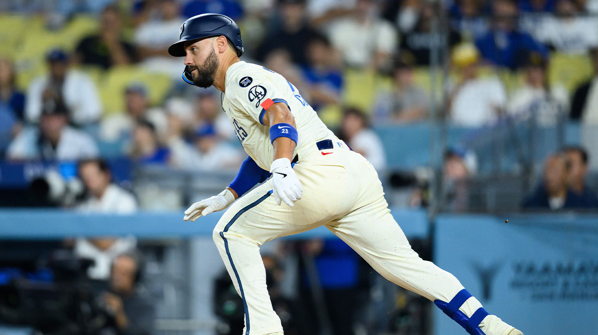 Los Angeles Dodgers left fielder Michael Conforto (23) runs on a groundball during the eighth inning against the San Diego Padres at Dodger Stadium.