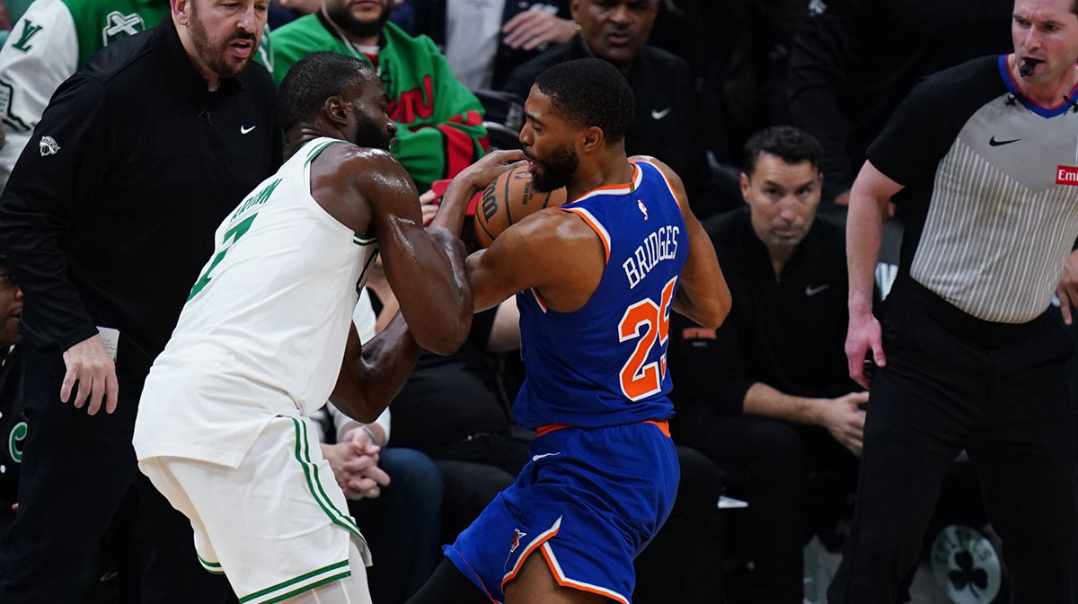 New York Knicks forward Mikal Bridges (25) strips the ball from Boston Celtics guard Jaylen Brown (7) winning the game in overtime during game one of the second round for the 2025 NBA Playoffs at TD Garden.