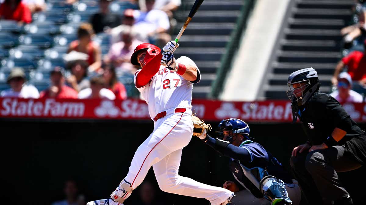 Los Angeles Angels designated hitter Mike Trout (27) follows through on a swing for a three-run home run during the third inning at Angel Stadium of Anaheim. 