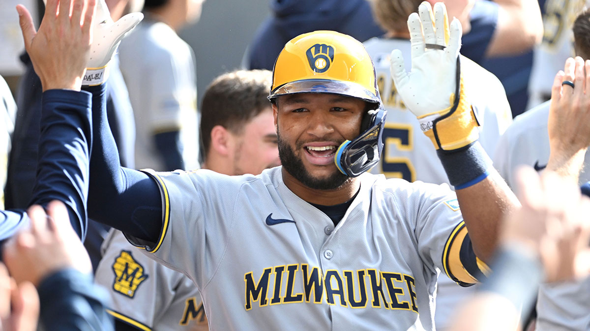 Milwaukee Brewers center fielder Jackson Chourio (11) celebrates with team mates in the duout after hitting a solo home run against the Toronto Blue Jays in the ninth inning at Rogers Centre.