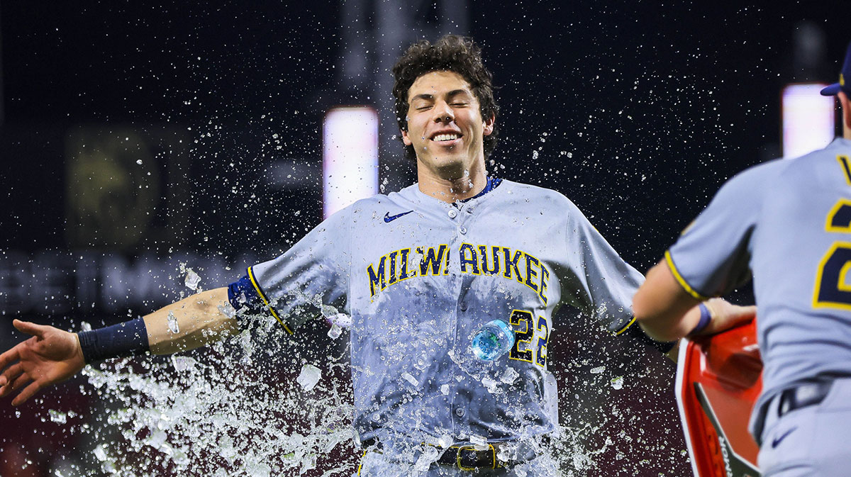 Milwaukee Brewers first baseman Andrew Vaughn (28) dumps water on designated hitter Christian Yelich (22) after the victory over the Cincinnati Reds at Great American Ball Park.