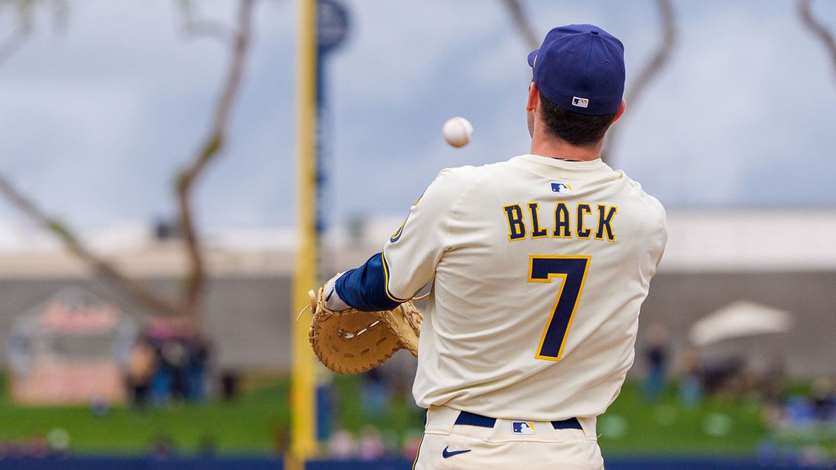 Milwaukee Brewers infielder Tyler Black (7) throws from first during a spring training game against the San Diego Padres at American Family Fields of Phoenix.