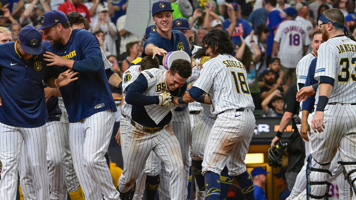 Milwaukee Brewers left fielder Isaac Collins (6) celebrates with teammates after hitting a walk-off home run in the ninth inning against the New York Mets at American Family Field.