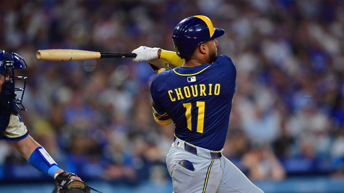 Milwaukee Brewers right fielder Jackson Chourio (11) hits a single against the Los Angeles Dodgers during the seventh inning at Dodger Stadium.