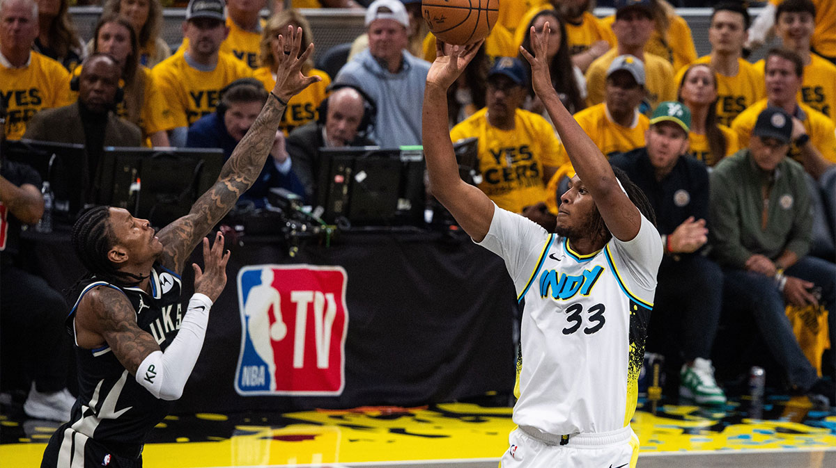 Indiana Pacers center Myles Turner (33) shoots the ball while Milwaukee Bucks guard Kevin Porter Jr. (3) defends during game five of the first round for the 2024 NBA Playoffs at Gainbridge Fieldhouse.