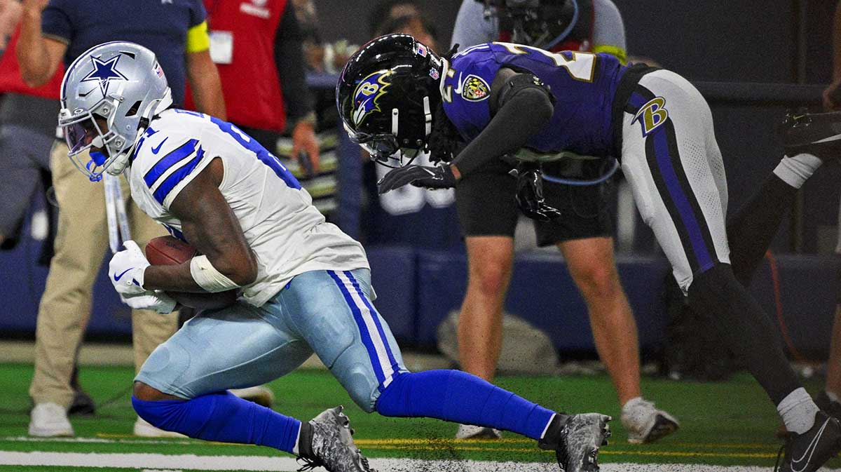 Dallas Cowboys wide receiver Jonathan Mingo (81) catches a pass in front of Baltimore Ravens cornerback T.J. Tampa (27) during the second half at AT&T Stadium.