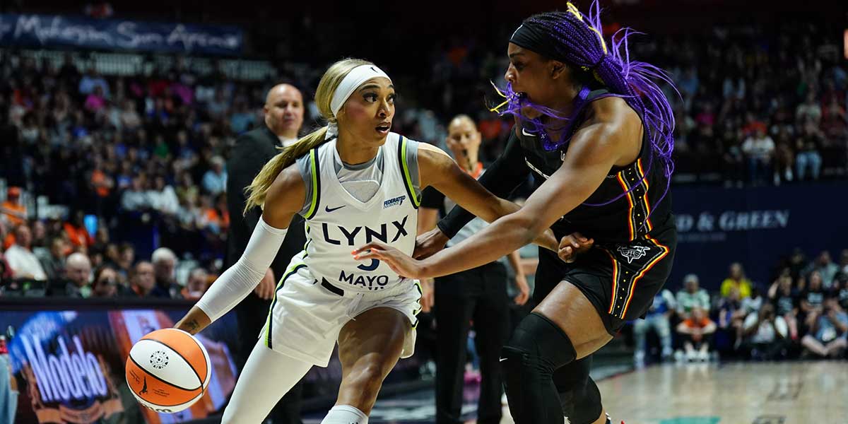 Minnesota Lynx guard DiJonai Carrington (3) drives the ball against Connecticut Sun forward Aaliyah Edwards (8) in the second half at Mohegan Sun Arena.