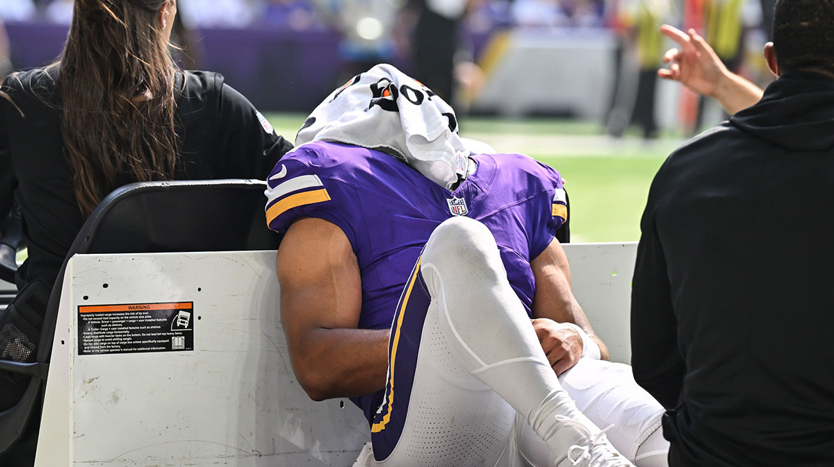 Minnesota Vikings wide receiver Rondale Moore (4) is carted off the field after suffering a lower leg injury during the second quarter against the Houston Texans at U.S. Bank Stadium.