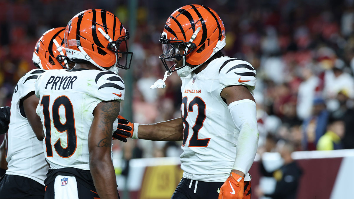Cincinnati Bengals wide receiver Mitchell Tinsley (82) celebrates with teammates after scoring a touchdown against the Washington Commanders during the first half at Northwest Stadium.