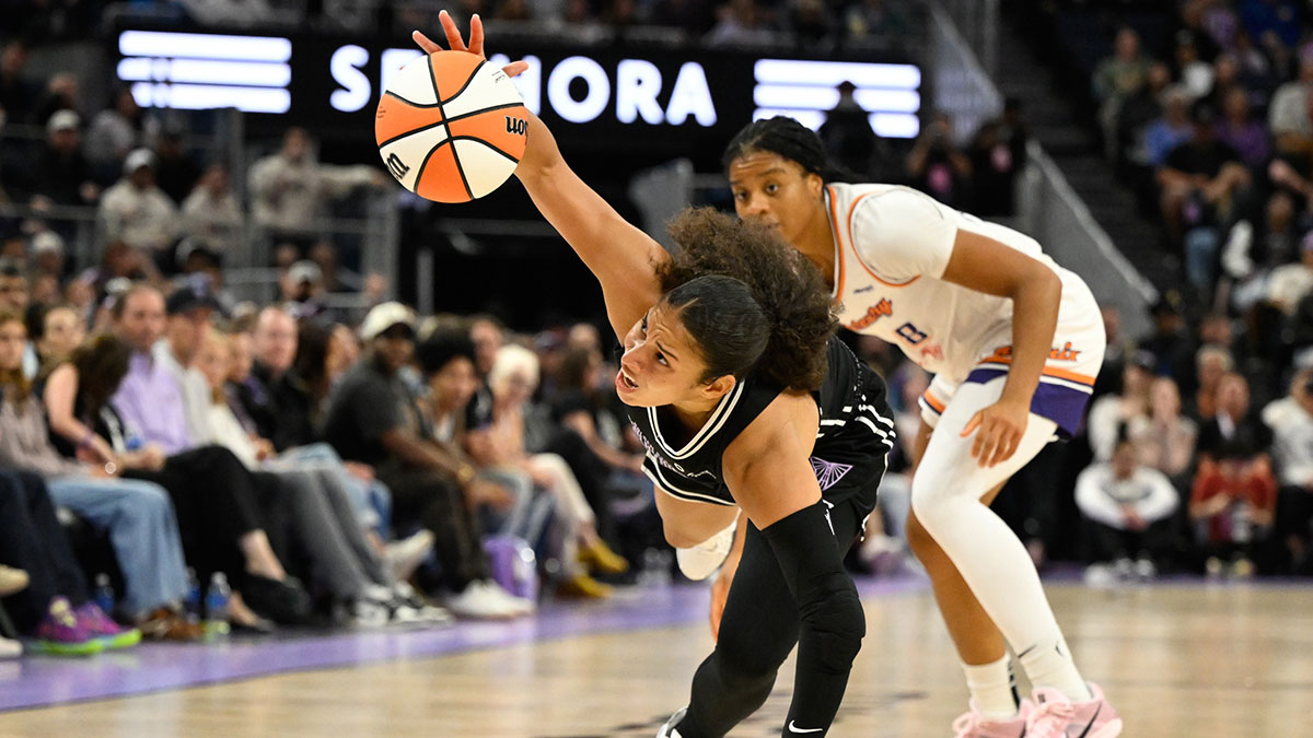Golden State Valkyries guard Veronica Burton (22) gets fouled by Phoenix Mercury guard Monique Akoa Makani (8) in the fourth quarter at Chase Center.