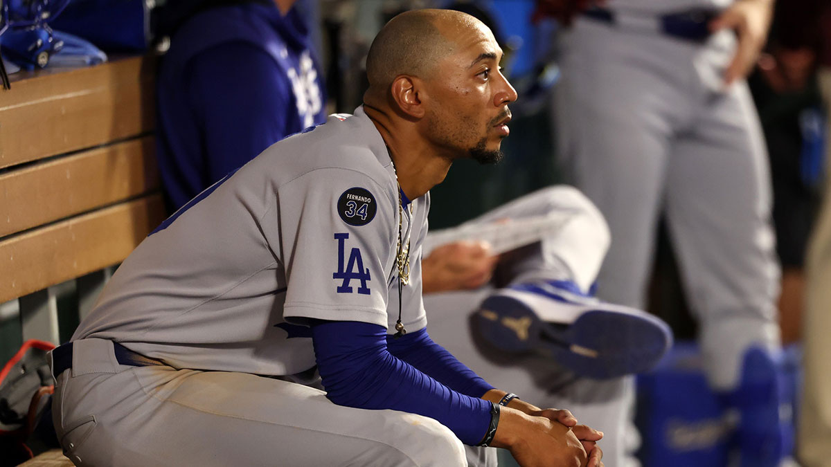 Aug 13, 2025; Anaheim, California, USA; Los Angeles Dodgers shortstop Mookie Betts (50) looks on in the dugout during the ninth inning against the Los Angeles Angels at Angel Stadium.