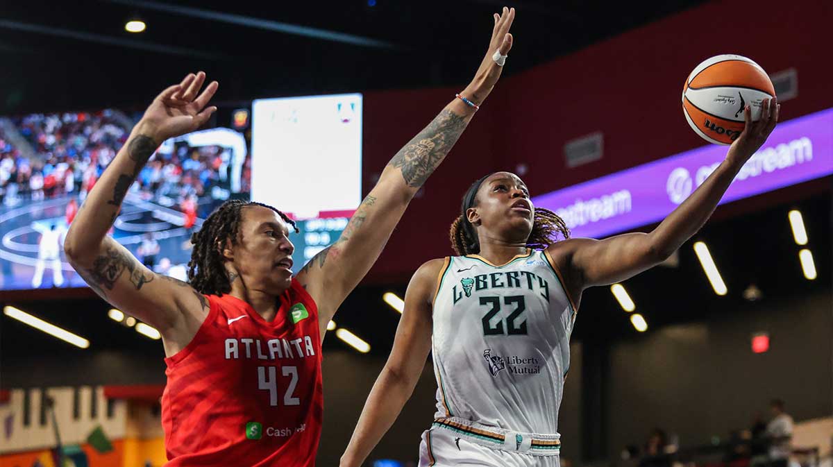 New York Liberty forward Kennedy Burke (22) attempts to shoot against Atlanta Dream center Brittney Griner (42) during the third quarter at Gateway Center Arena at College Park.