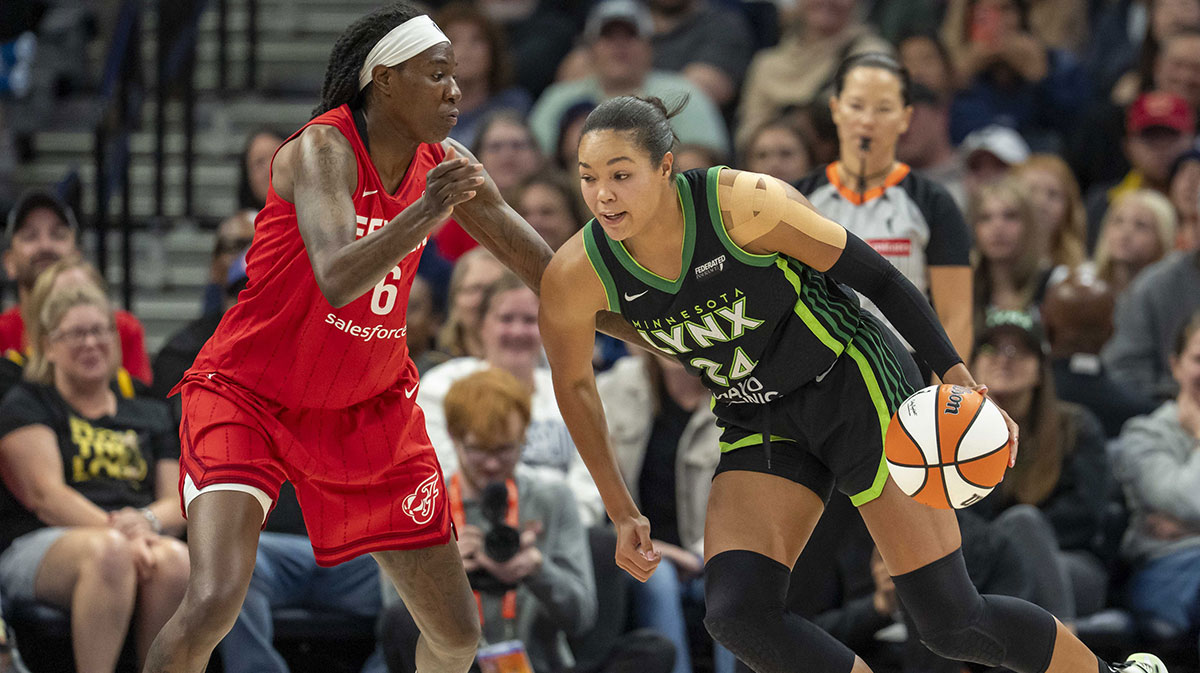 Minnesota Lynx forward Napheesa Collier (24) drives to the basket past Indiana Fever forward Natasha Howard (6) in the second half at Target Center.