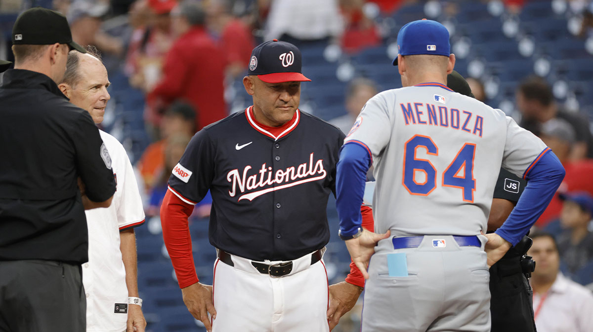 Washington Nationals interim manager Miguel Cairo (22) and New York Mets manager Carlos Mendoza (64) meet at home plate prior to their game at Nationals Park.