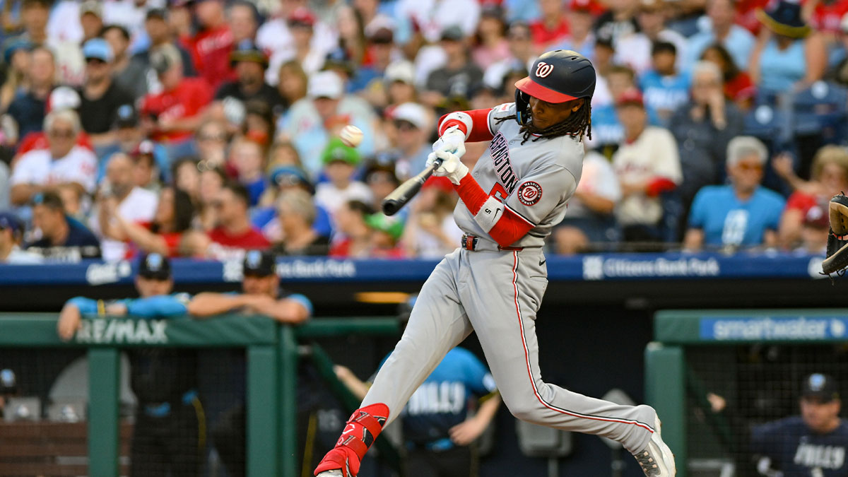 Washington Nationals shortstop CJ Abrams (5) hits a single against the Philadelphia Phillies during the first inning at Citizens Bank Park.