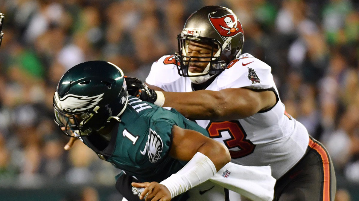 Philadelphia Eagles quarterback Jalen Hurts (1) is hit byTampa Bay Buccaneers defensive end Ndamukong Suh (93) during the second quarter at Lincoln Financial Field.