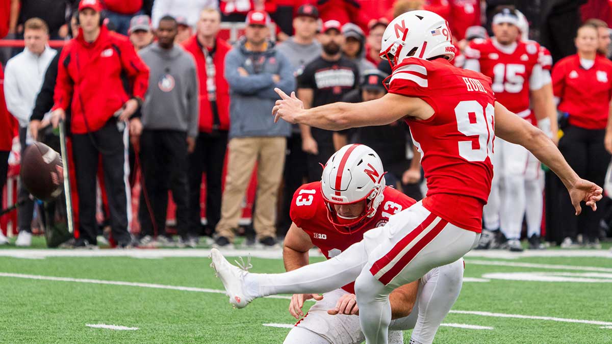 Nebraska Cornhuskers place kicker John Hohl (90) kicks a PAT against the UCLA Bruins during the second quarter at Memorial Stadium.