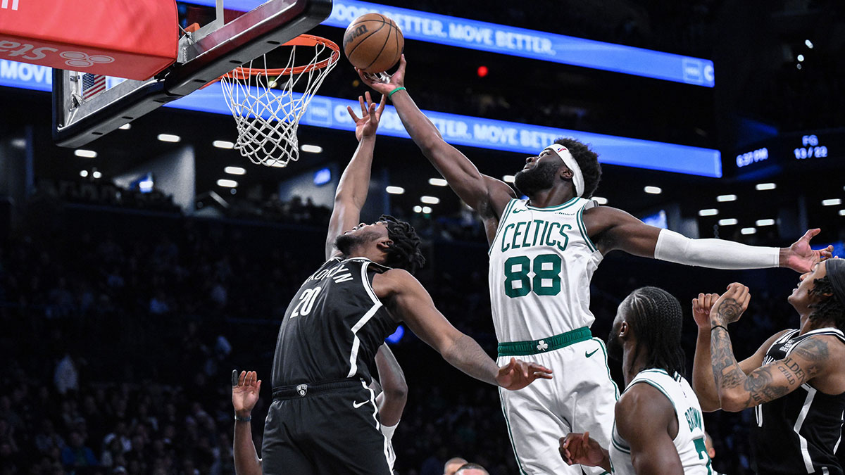 Brooklyn Nets center Day'Ron Sharpe (20) and Boston Celtics center Neemias Queta (88) compete for a rebound during the first half at Barclays Center.