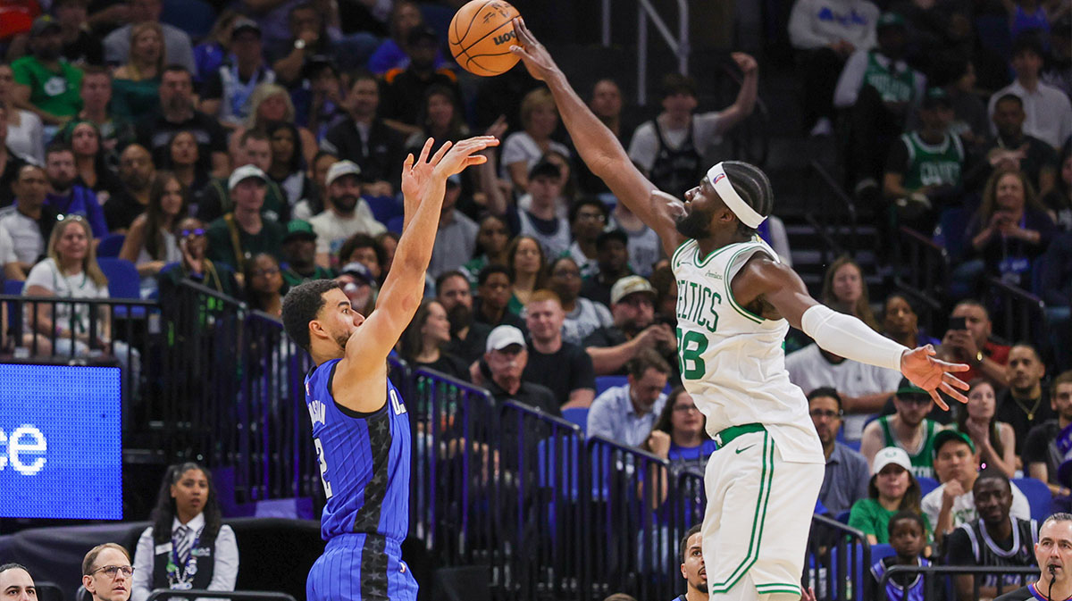 Boston Celtics center Neemias Queta (88) blocks a shot by Orlando Magic guard Caleb Houstan (2) during the second quarter at Kia Center