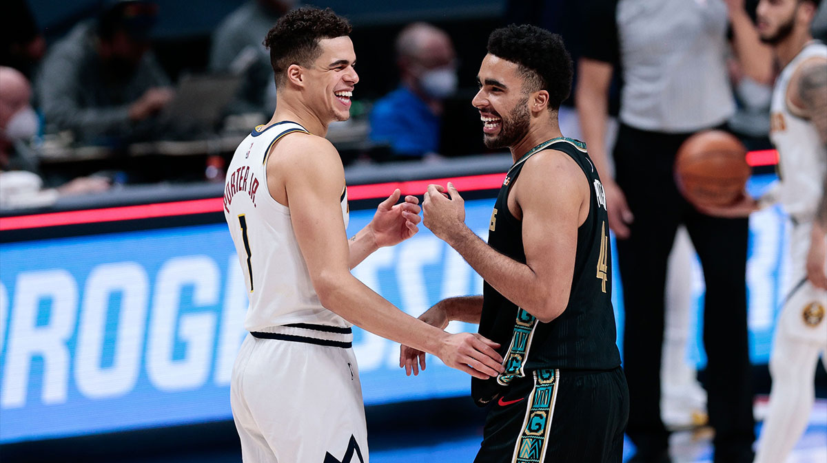 Nuggets forward Michael Porter Jr. (1) greets his brother Memphis Grizzlies forward Jontay Porter (4) after the game at Ball Arena