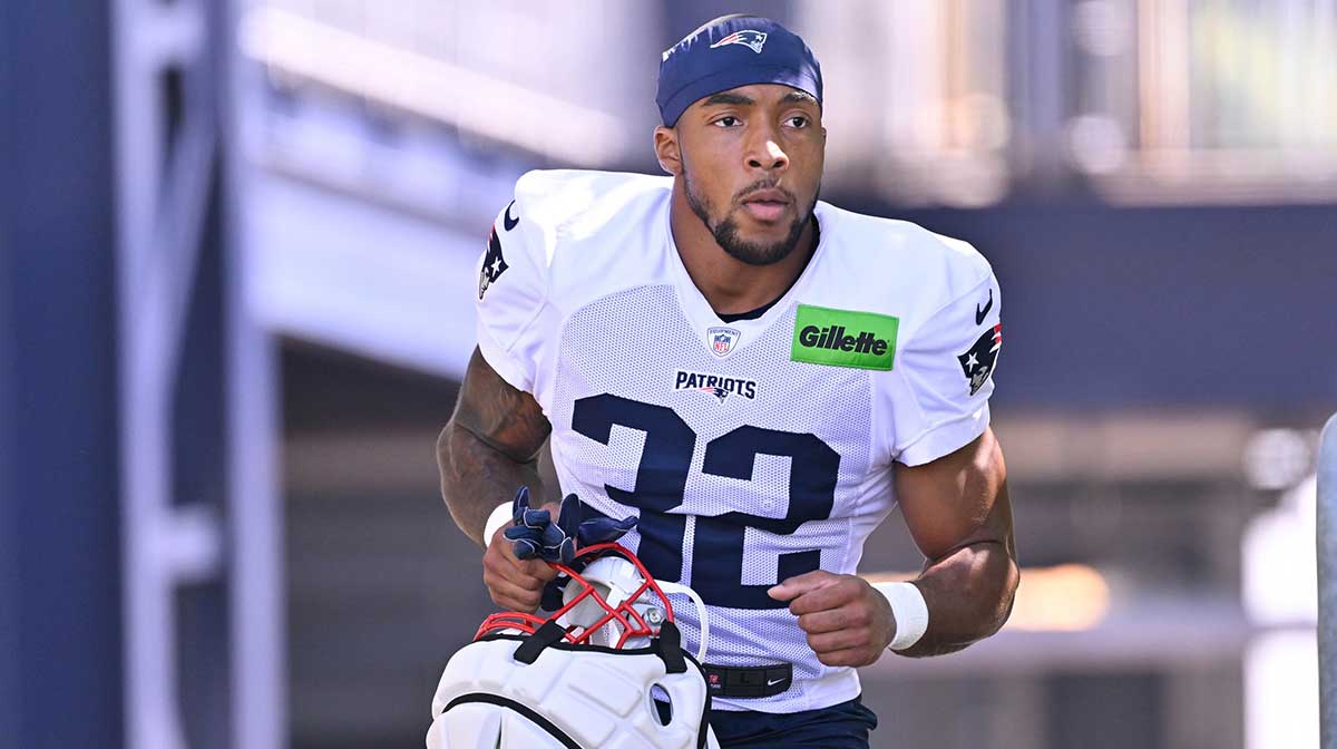 New England Patriots running back TreVeyon Henderson (32) heads to the practice fields for training camp at Gillette Stadium.