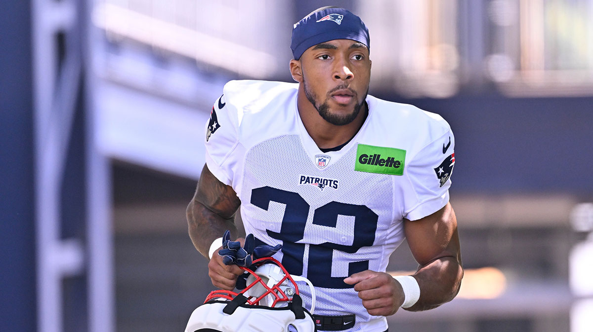 New England Patriots running back TreVeyon Henderson (32) heads to the practice fields for training camp at Gillette Stadium.