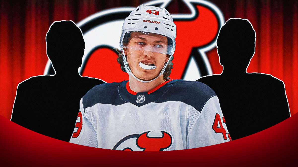 Luke Hughes in the center with two mystery players. Devils logo in the background.