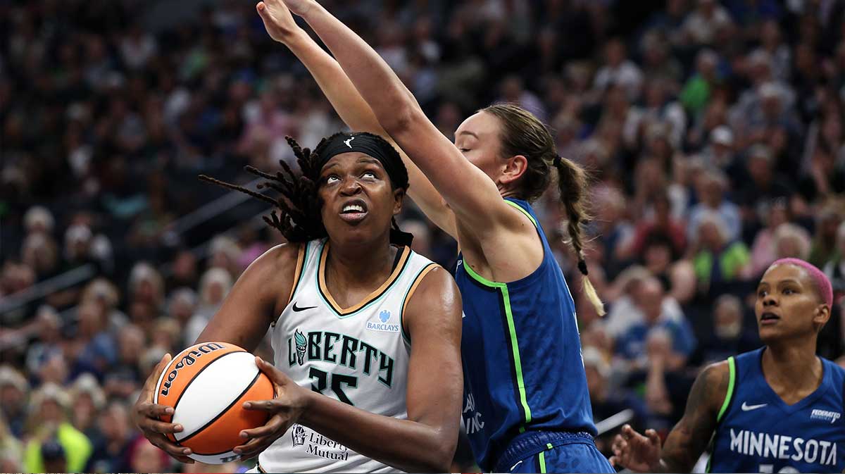 New York Liberty center Jonquel Jones (35) works towards the basket as Minnesota Lynx forward Alanna Smith (8) defends during the first quarter.