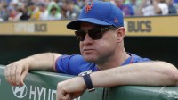 New York Mets manager Carlos Mendoza (64) looks over the dugout railing before the game against the Pittsburgh Pirates at PNC Park. Mandatory Credit: Charles LeClaire-Imagn Images