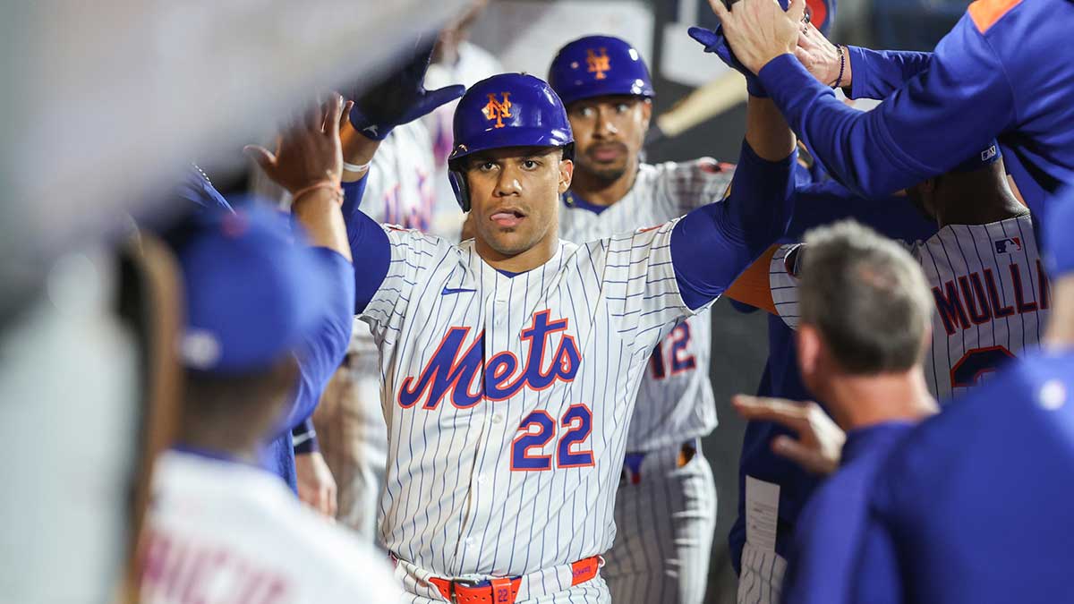 New York Mets right fielder Juan Soto (22) is greeted in the dugout after hitting a two run home run in the second inning against the Atlanta Braves at Citi Field.