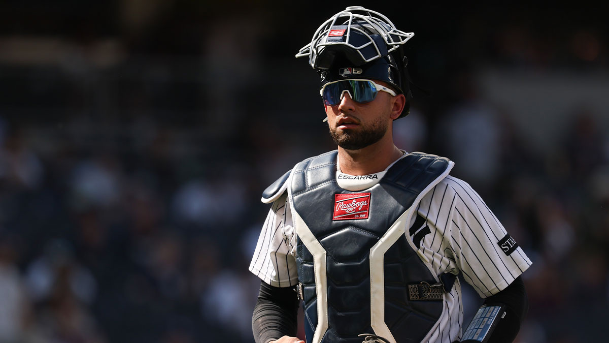 New York Yankees catcher J.C. Escarra (25) walks off the field after the top of the eighth inning against the Athletics at Yankee Stadium.