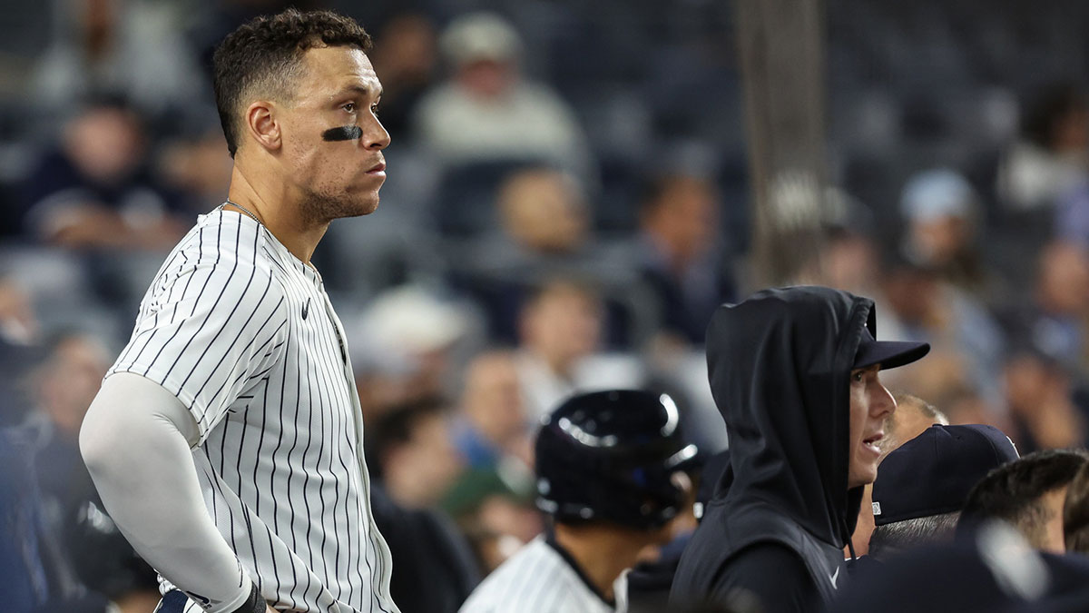 New York Yankees designated hitter Aaron Judge (99) watches from the dugout in the ninth inning against the Boston Red Sox at Yankee Stadium.