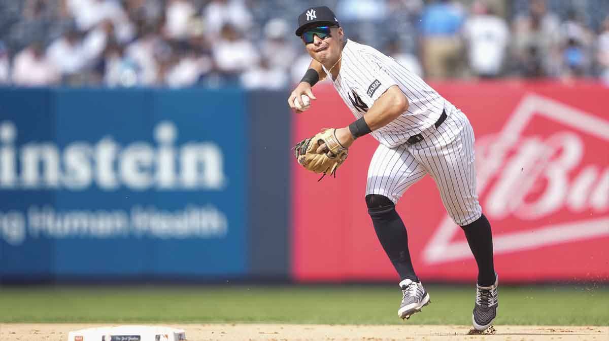 New York Yankees shortstop Anthony Volpe (11) throws out Washington Nationals center fielder Jacob Young (30) (not pictured) after fielding a ground ball during the eighth inning at Yankee Stadium.