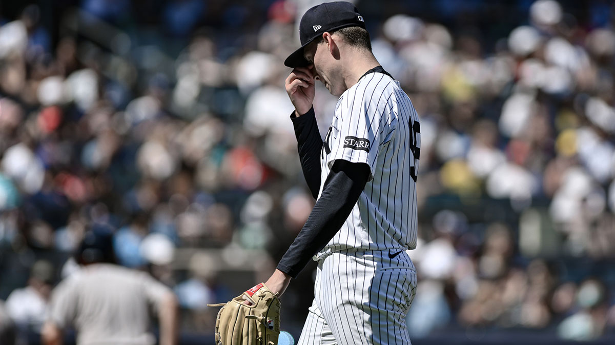 New York Yankees pitcher Will Warren (98) reacts after the fourth inning against the Boston Red Sox at Yankee Stadium.