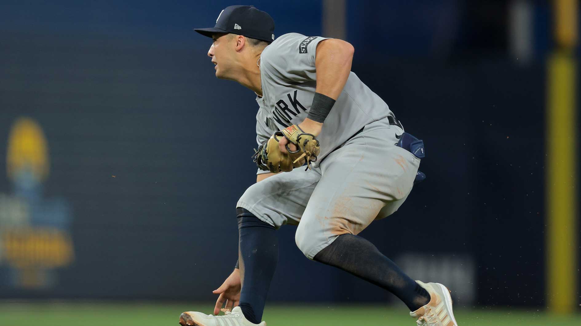 New York Yankees shortstop Anthony Volpe (11) cannot catch a ground ball against Miami Marlins second baseman Xavier Edwards (not pictured) during the seventh inning at loanDepot Park.