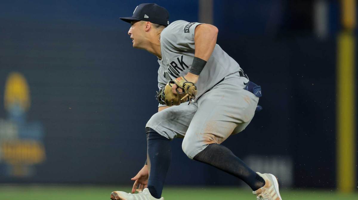 New York Yankees shortstop Anthony Volpe (11) cannot catch a ground ball against Miami Marlins second baseman Xavier Edwards (not pictured) during the seventh inning at loanDepot Park.