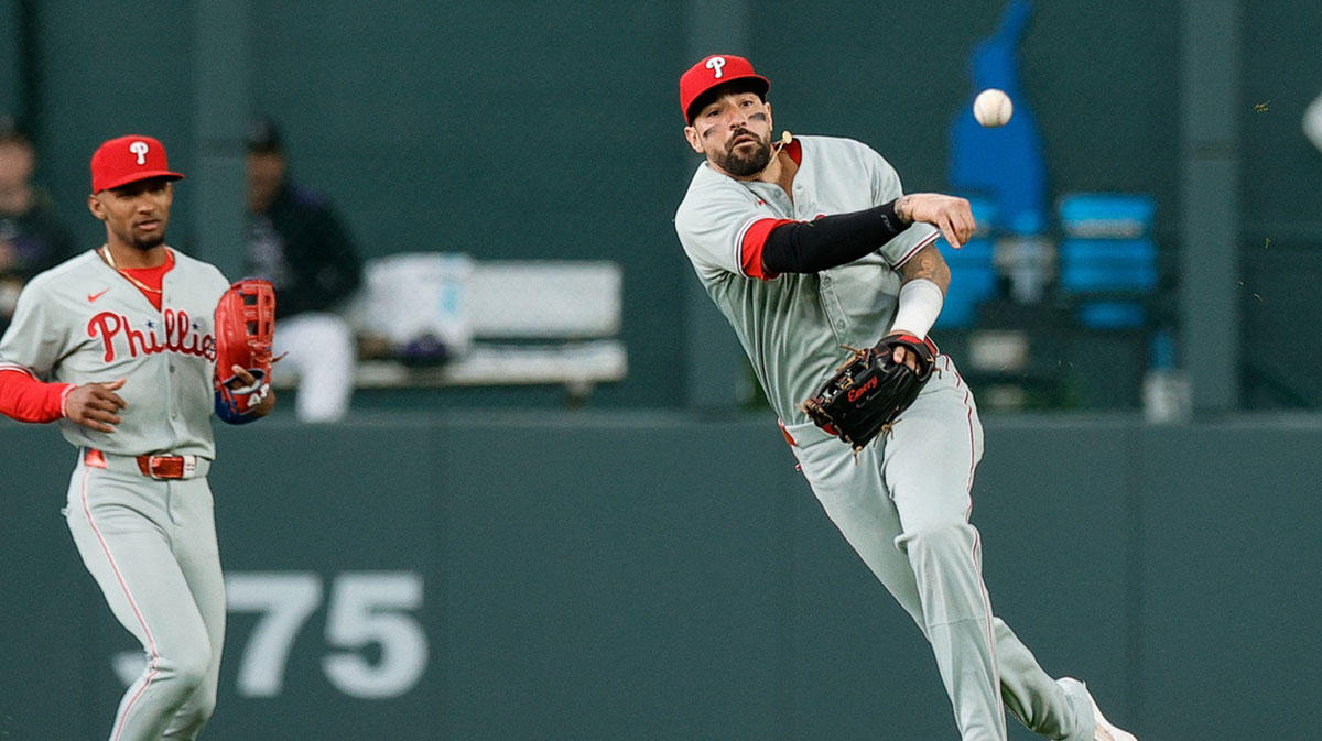 May 19, 2025; Denver, Colorado, USA; Philadelphia Phillies right fielder Nick Castellanos (8) throws to second in the fourth inning against the Colorado Rockies at Coors Field.