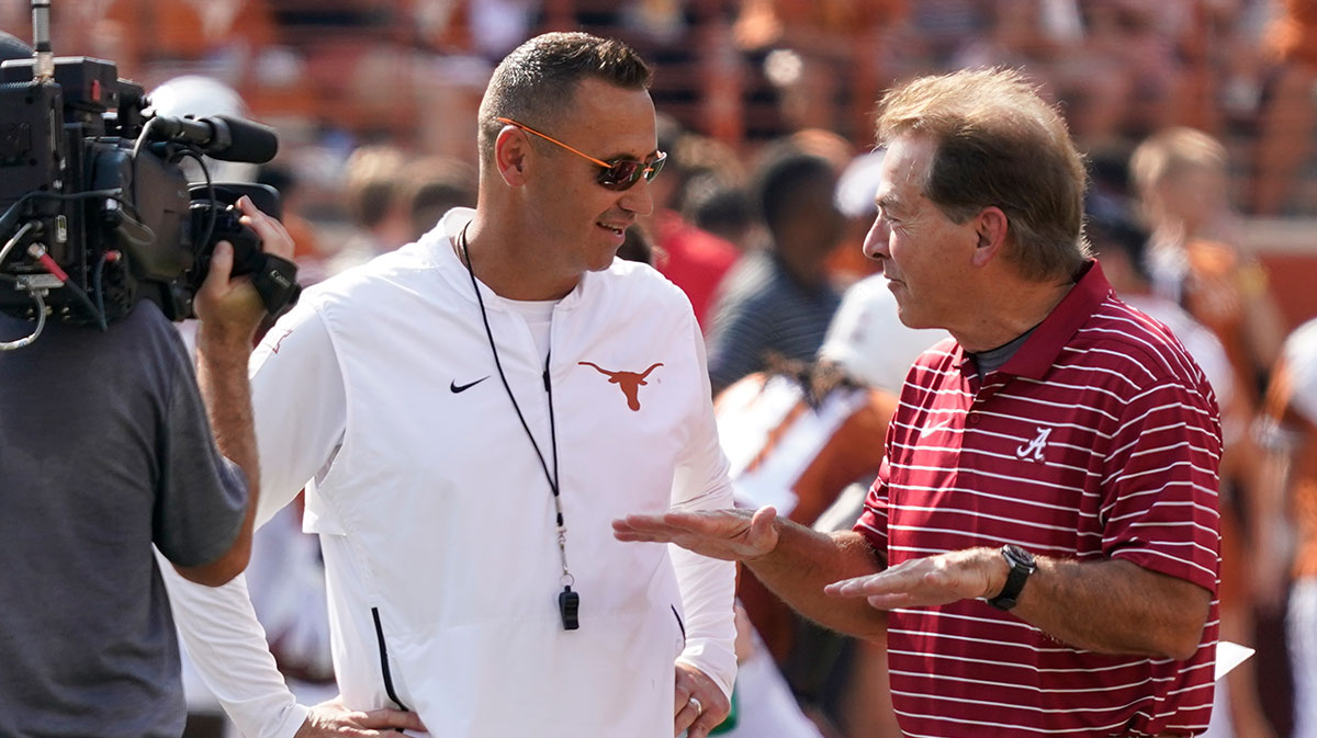 Texas Longhorns head coach Steve Sarkisian talks with Alabama Crimson Tide head coach Nick Saban before the game at Darrell K Royal-Texas Memorial Stadium.