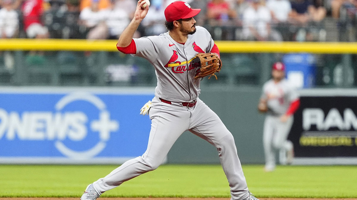 St. Louis Cardinals third baseman Nolan Arenado (28) fields the ball in the first inning against the Colorado Rockies at Coors Field.
