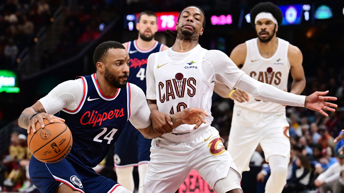Los Angeles Clippers guard Norman Powell (24) drives to the basket against Cleveland Cavaliers guard Darius Garland (10) during the second half at Rocket Arena.