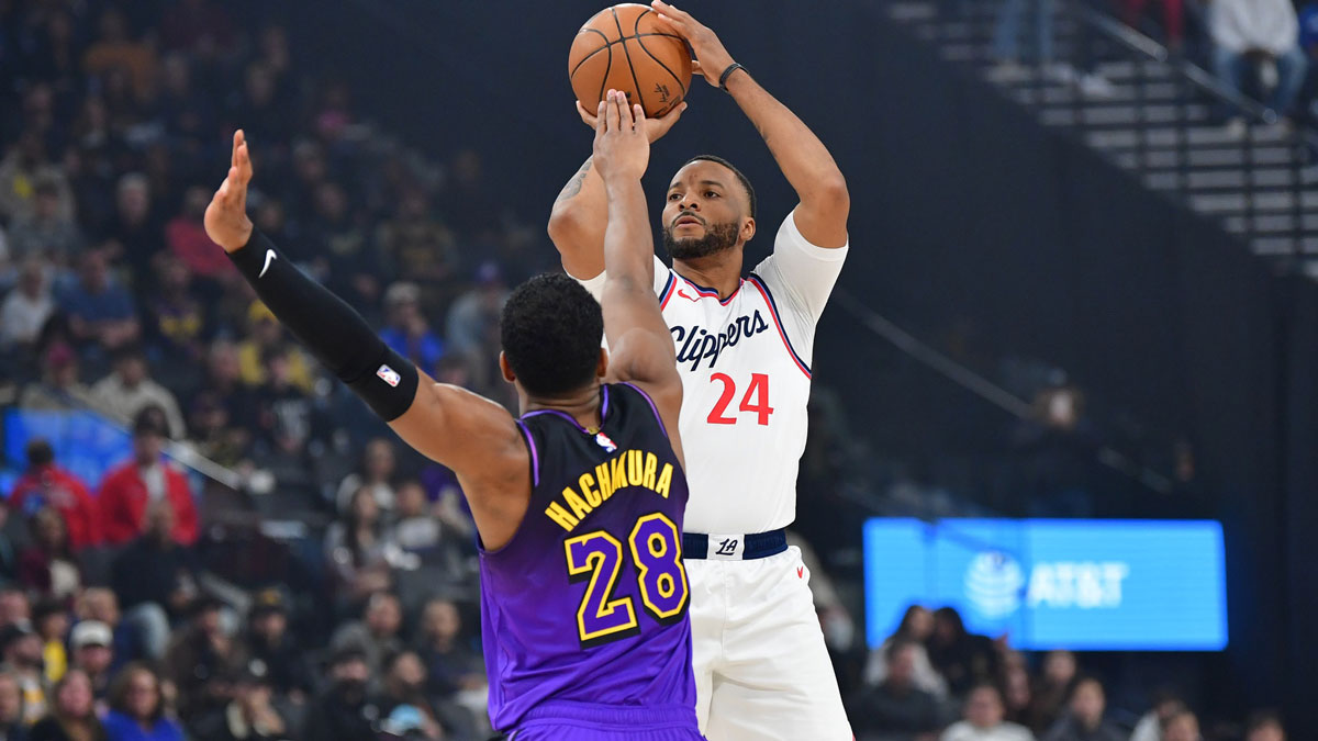 Los Angeles Clippers guard Norman Powell (24) shoots against Los Angeles Lakers forward Rui Hachimura (28) during the first half at Intuit Dome.