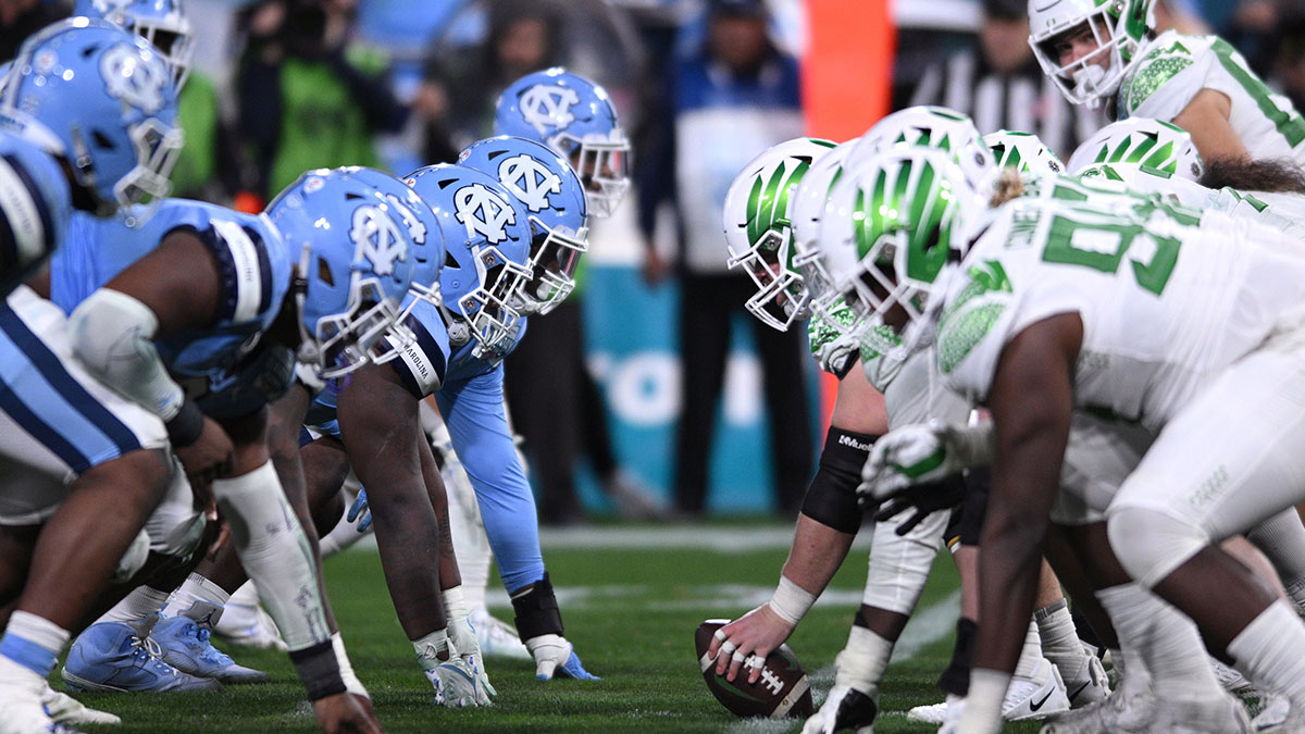 The North Carolina Tar Heels defensive line and Oregon Ducks offensive line before the snap during the second half of the 2022 Holiday Bowl at Petco Park.