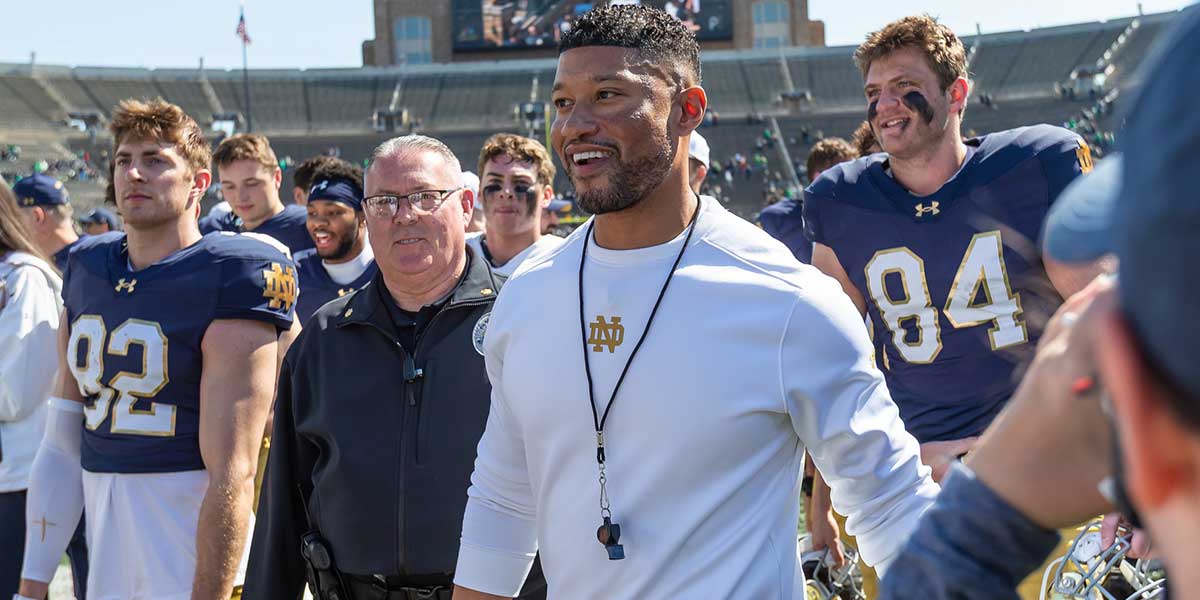 Notre Dame Fighting Irish head coach Marcus Freeman smiles as he walks off the field after the Blue-Gold game at Notre Dame Stadium.