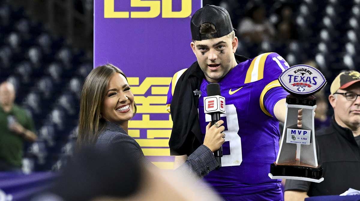 LSU Tigers quarterback Garrett Nussmeier (13) holds up the MVP trophy during a post game interview of the game against the Baylor Bears at NRG Stadium. The Tigers defeat the Bears 44-31.