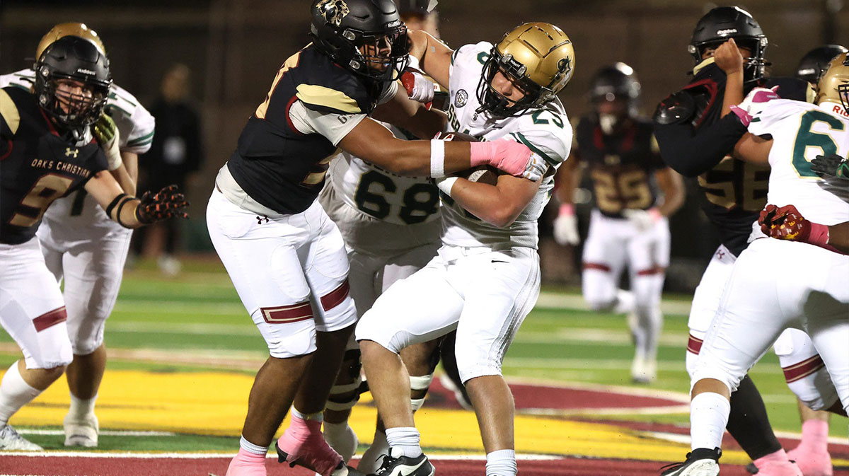 St. Bonaventure running back Koen Glover is stopped by the Oaks Christian defense during the first quarter of Oaks Christian's 35-0 Marmonte League win over St. Bonaventure Friday night at Redell Field.