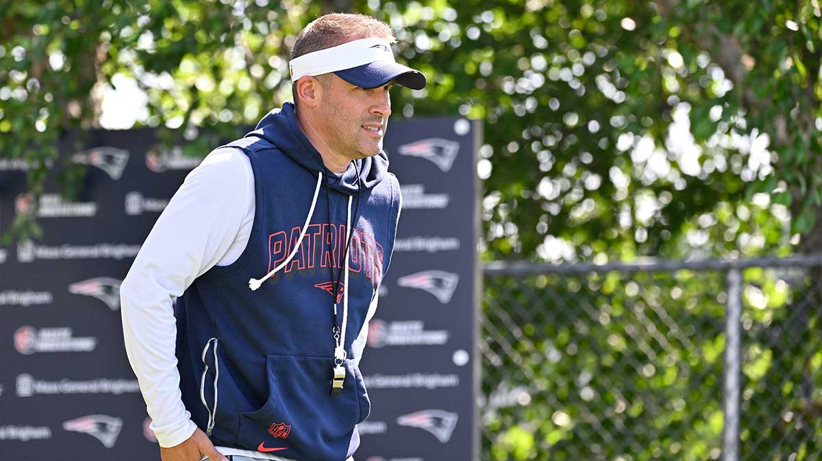 New England Patriots offensive coordinator Josh McDaniels heads to the practice fields for training camp at Gillette Stadium. 