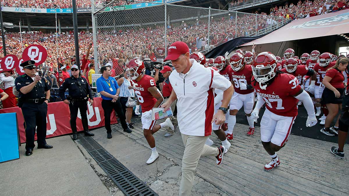 Oklahoma Sooners head coach Brent Venables leads his team out of the tunnel before the Red River Showdown college football game between the University of Oklahoma (OU) and Texas at the Cotton Bowl