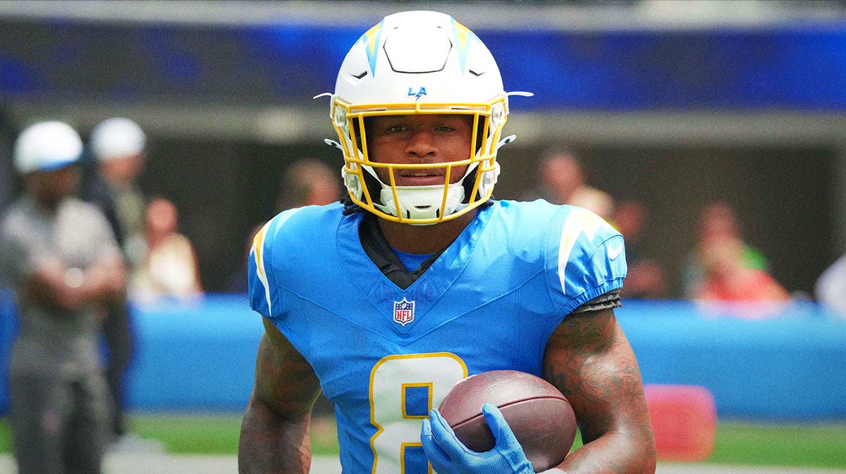 Los Angeles Chargers running back Omarion Hampton (8) carries the ball before the game against the New Orleans Saints at SoFi Stadium.